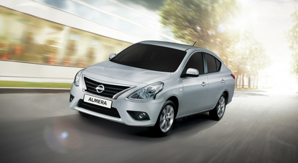 Nissan Almera driving on road